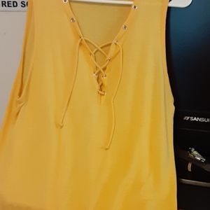 Yellow top with beautiful criss cross strings..